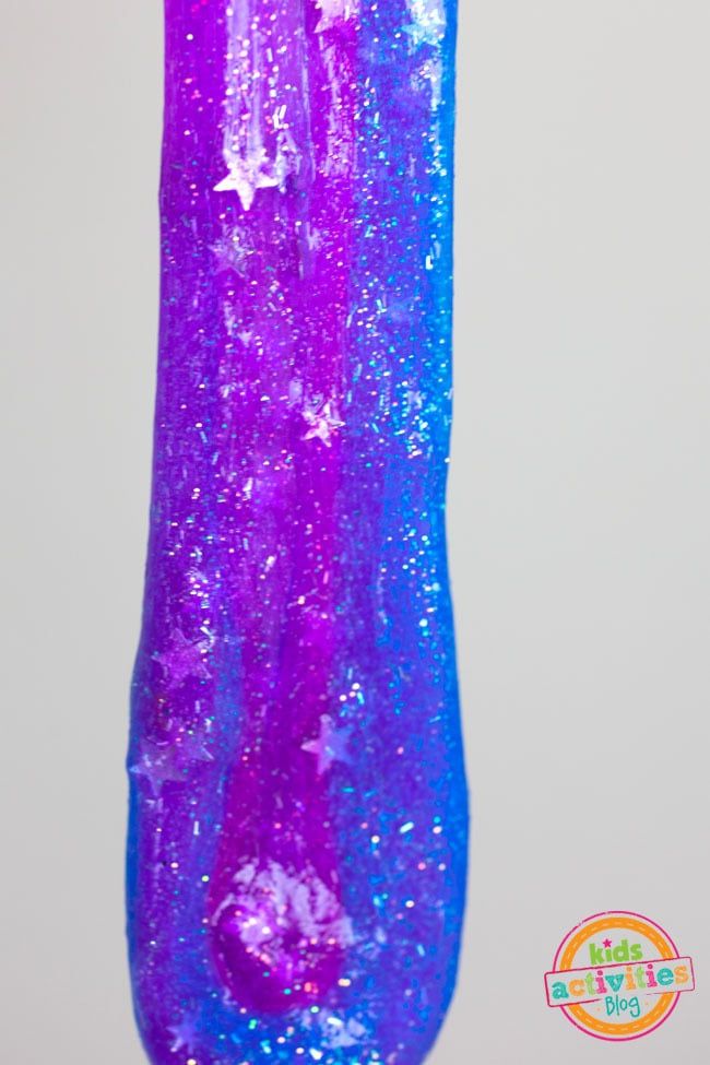 a purple and blue vase with stars on it