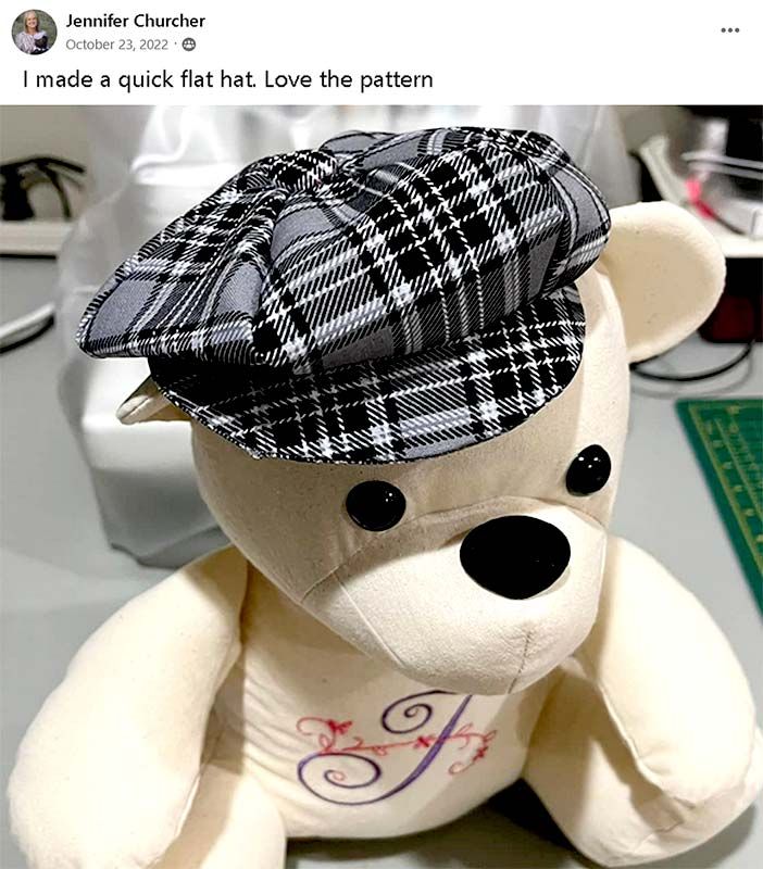 a teddy bear with a hat on it's head