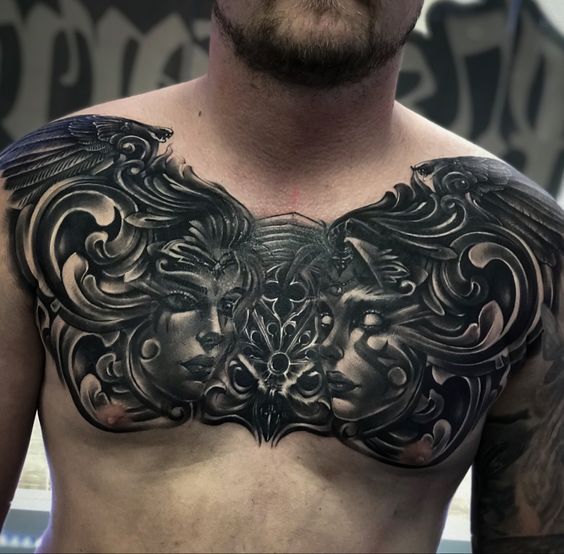 a man with tattoos on his chest is looking at the camera