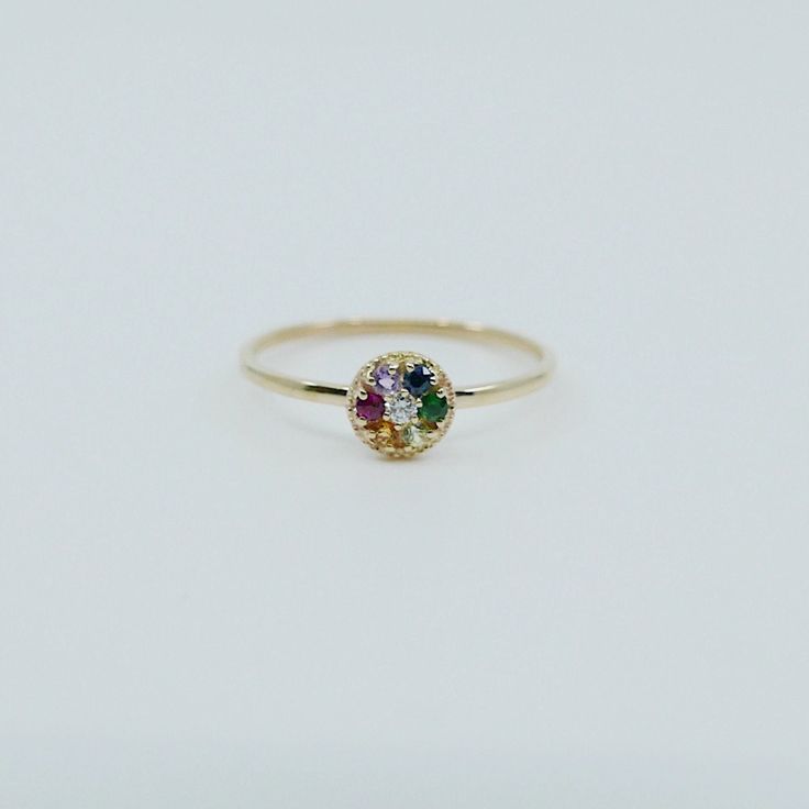 Add some color into your life. The dainty nature of these stones bring life in a petite way. This ring is your next mainstay. The shape, the detail, and the color combination in the 14k yellow gold make the colors POP! Life is a blank canvas, use your painters palette as inspiration. Details: Made with 14k gold (available in yellow gold, rose gold, and white gold) "Palette" measures about 5.6mm diameter Stones measure about 1.7mm center stone (diamond) and 1.5mm for all exterior stones Free Ship Rainbow 14k Gold Stackable Jewelry, 14k Gold Multi-stone Stackable Rings, Rainbow Multi-stone Rings In 14k Gold, 14k Gold Rainbow Rings With Multi-stone, 14k Gold Rainbow Multi-stone Rings, Multi-stone 14k Yellow Gold Birthstone Ring, Multi-stone Yellow Gold Birthstone Ring In 14k, 14k Yellow Gold Multi-stone Birthstone Ring, Yellow Gold Multi-stone Birthstone Ring In 14k Gold