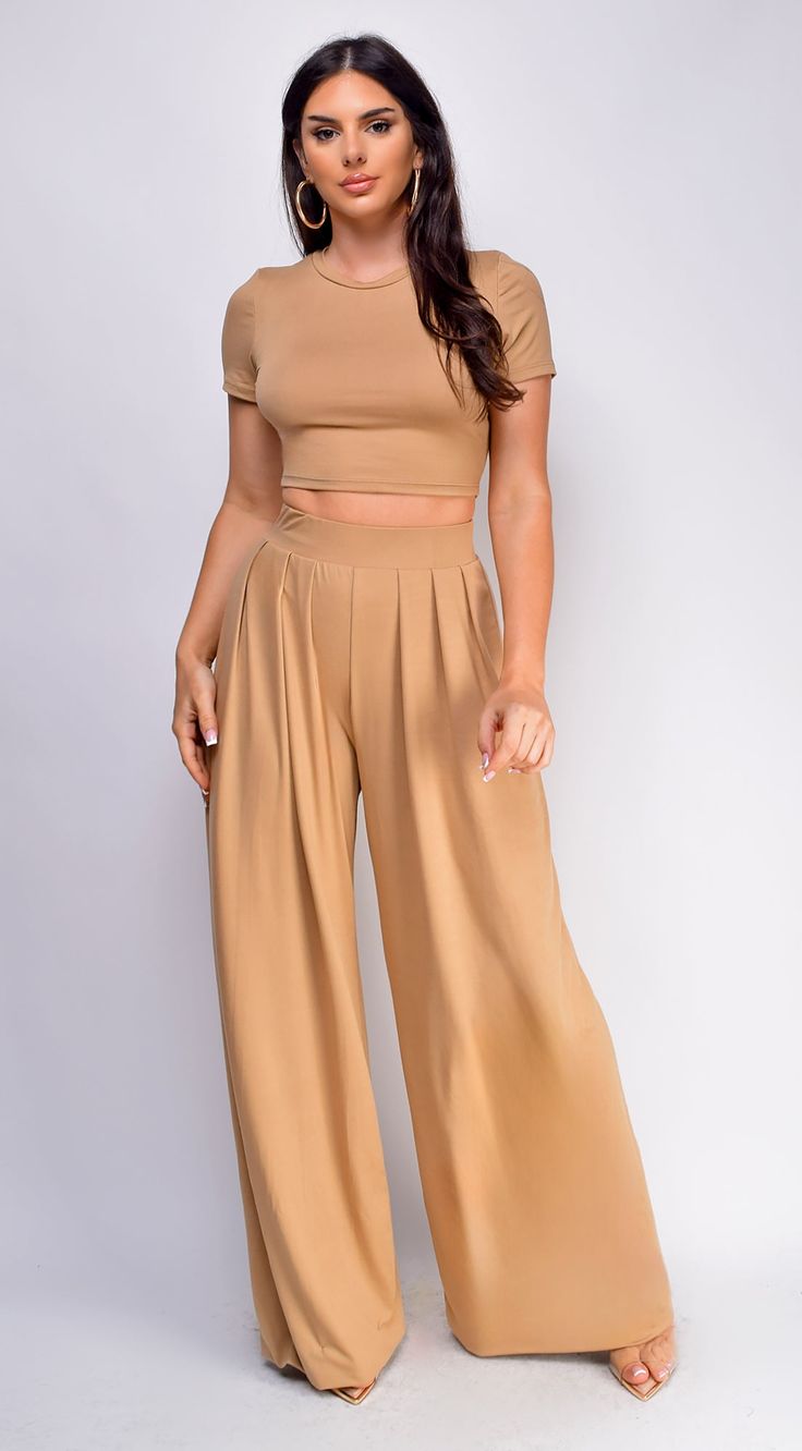 Top & pants set Wide leg Crop top Elastic waistband 96% Polyester 4% Spandex Model's height: 5'6" Model wears size S Fitted High-waist Bottoms, Fitted High Waist Two-piece Bottoms, Solid Color Fitted Wide Leg Sets, Fitted Solid Color Wide Leg Sets, Fitted Wide Leg Solid Color Sets, Solid Two-piece Wide Leg Pants, Solid Two-piece Wide Leg Bottoms, Fitted High Waist Two-piece Bottoms Set, High Waist Stretch Two-piece Set