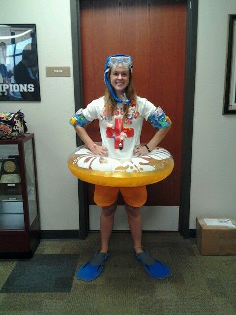 a woman standing in front of a door wearing an inflatable life preserver