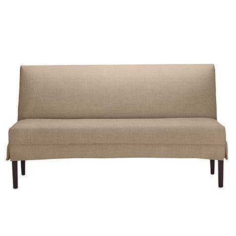 a beige couch sitting on top of a wooden frame