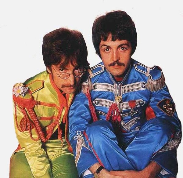 the two men are dressed in colorful outfits