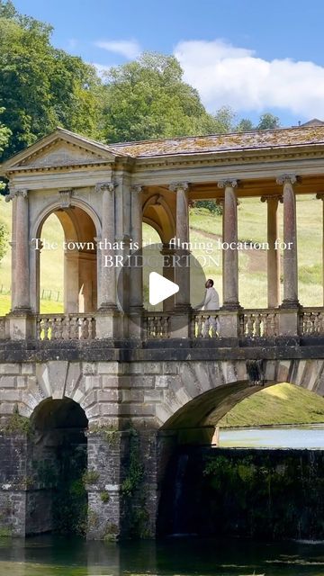 an old stone bridge with pillars and arches