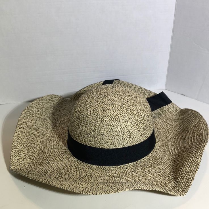 This Hat Is Brand New With Tags And Has Never Been Worn. This Floppy Straw Beach Hat Is Black And Cream. It Has A Wide Brim And A Black Bow. It Has 50+ Upf Protection And Comes With A Removable Cord. This Hat Is A Large And The Material Is 60% Paper, 20% Cotton And 20% Polyester. Message Me With Questions! Beige Floppy Sun Hat For Beach Season, Beige Floppy Sun Hat For Beach, Trendy Beige Hat For Sunbathing, Beige Floppy Sun Hat For Vacation, Beige Floppy Sun Hat For The Beach, Chic Cream Straw Hat For The Beach, Chic Cream Straw Hat For Beach, Chic Hats For Vacation Warm Weather, Chic Vacation Hats For Warm Weather