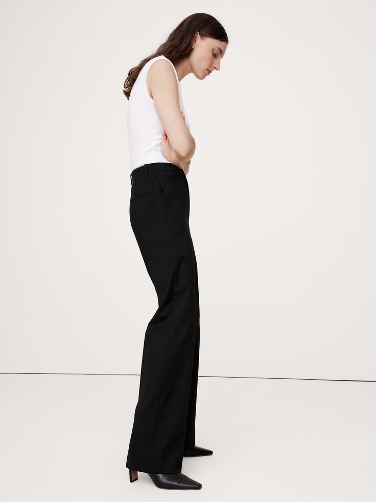 We cut this pant for a sleek and sharply-tailored fit, opting for a barely-there Hollywood waistband and darts at the back waist to create a clean look that's also ultra-comfortable.  For fabric, we reached for our Siena Italian wool—a customer favorite for its all-weather weight and hint of stretch.  High Rise Modern Straight: High rise (12") with a relaxed fit through the thighs and a straight leg.  Full length.  Fabric from Italy's Marzotto mill.  Responsible Wool Standard Certified: This global standard protects the sheep that supply the wool for this garment as well as the land they graze, working to make it better for the environment and the sheep.  Zip fly with hook-and-bar closure.  Front and back pockets.  Unlined.  High Rise Modern Straight: High rise (12") with a relaxed fit thr Modern Fitted Bottoms For Workwear, Minimal Stretch Full Length Pants For Workwear, Sleek Full-length Pants For Workwear, Chic Dress Pants With Minimal Stretch For Business Casual, Sleek Full Length Workwear Pants, Chic Dress Pants For Business Casual, Tapered Leg Bottoms With Minimal Stretch For Workwear, Classic Tapered Leg Pants With Minimal Stretch, Business Casual Straight Leg Dress Pants With Minimal Stretch