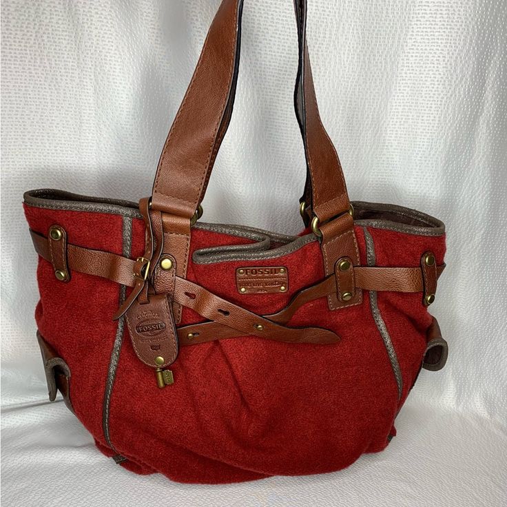 Like New, Never Used Fossil Tote Style Handbag. Deep Red, Flannel Feel Fabric With Brown Leather Handles/Straps And Trim. Brass Tone Hardware, Magnetic Closure, 3 Interior Pockets (1 Zipper, 2 Slip), 2 Small Exterior Pockets. Approx 16” Wide X 11” Tall Smoke And Pet Free Home. Burgundy Casual Bag With Double Handle, Casual Burgundy Bag For Errands, Casual Satchel With Leather Trim For Shopping, Red Tote Bag With Leather Handles, Leather Shopping Bags With Strap, Shopping Satchel Shoulder Bag With Strap, Red Shoulder Bag With Leather Handles, Leather Bag For Errands, Casual Burgundy Satchel For Travel