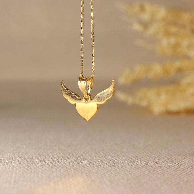 Gold Angel Necklace Gold Customizable Heart Necklace Angel Wing Pendant Pretty Necklace . Unique custom necklace who loves Angels!! ➤ Necklace Details * 14K Yellow Gold * Chain Gold Color Options; 14K White, Yellow, Rose Gold * Gold chain width: 0.25*0.30 millimeter ➤ Gold  AngelPendant Details *  Angel Pendant width: 20 millimeters *  Angel Pendant length: 12 millimeters * Ready to Ship 1-2 Business Days 💍 ISEA Jewels' pieces are handcrafted by 10-15 years of experienced craftsmen and made to Valentine's Day 14k Gold Pendant Necklace, Yellow Gold Heart Pendant Necklace For Valentine's Day, 14k Gold Heart Pendant Necklace For Gift, Yellow Gold Heart Necklace For Gift, Engraved Double Heart Yellow Gold Necklace, 14k Gold Pendant Charm Necklace For Valentine's Day, Yellow Gold Necklace With Heart Charm For Anniversary, Anniversary Gift Yellow Gold Necklace With Heart Charm, Yellow Gold Necklaces With Heart Charm For Keepsake