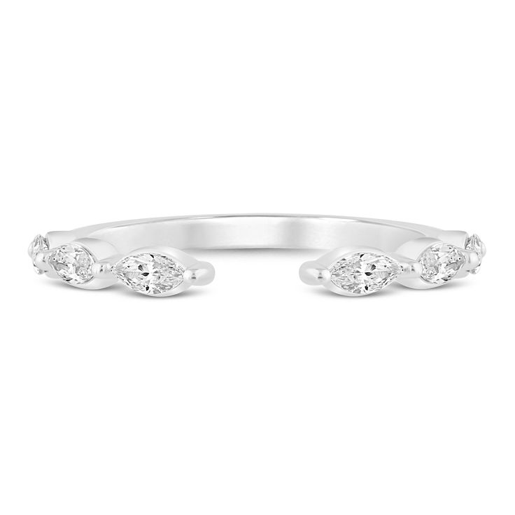 a white gold ring with three diamonds