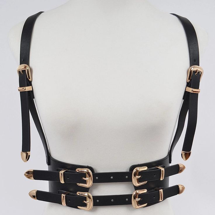 Get ready to buckle up in style with our Multi Buckle Harness Belt! This versatile accessory adds a touch of edgy flair to any outfit, while providing practical benefits like adjustable fit and extra support. So go ahead, strap on this must-have accessory and take your look to the next level (safely, of course)! Edgy Strapped Harness With Belt, Punk Harness With Adjustable Straps, Adjustable Strapped Harness With Belt, Adjustable Strapped Punk Harness, Edgy Adjustable Harness With Belt, Adjustable Belt Harness For Party, Party Harness With Belt Loops In Black, Edgy Harness With Belt For Night Out, Black Party Harness With Belt Loops