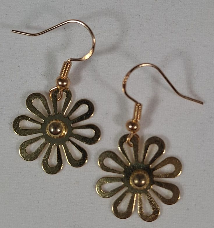 Dangle Earrings Gold Daisy's are just over 1.25 inches. These cute flowers were apart of another piece of jewelry that I picked up at a store closing a little while back. I dissembled the piece and left it plain. I feel like they turned out simple yet elegant. Fun for everyday especially in the spring or summer. Dainty Spring Flower Earrings For Pierced Ears, Flower-shaped Jewelry With Matching Earrings For Spring, Metal Flower-shaped Earrings For Spring, Flower-shaped Metal Earrings For Spring, Dainty Dangle Earrings For Spring, Spring Dainty Dangle Earrings, Dainty Spring Dangle Earrings, Spring Festival Metal Earrings For Gifts, Spring Festival Gift Earrings In Metal