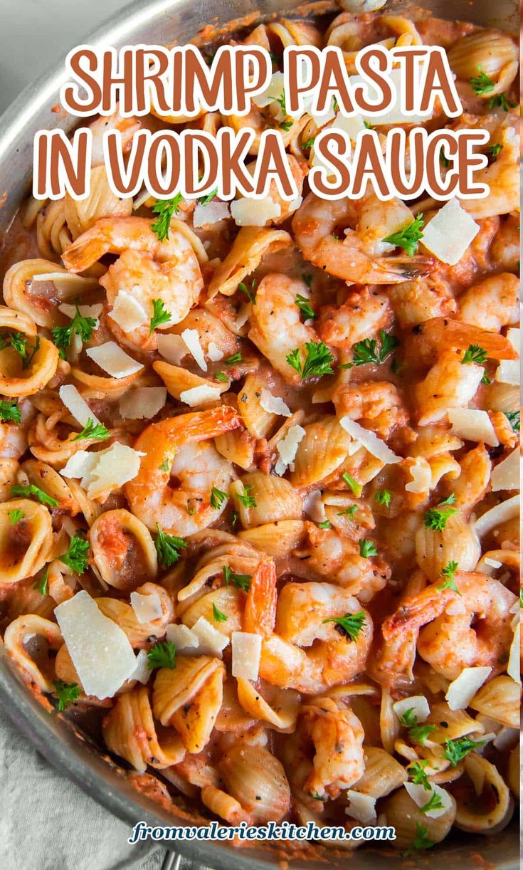 shrimp pasta in vodka sauce with parmesan cheese and parsley on the side