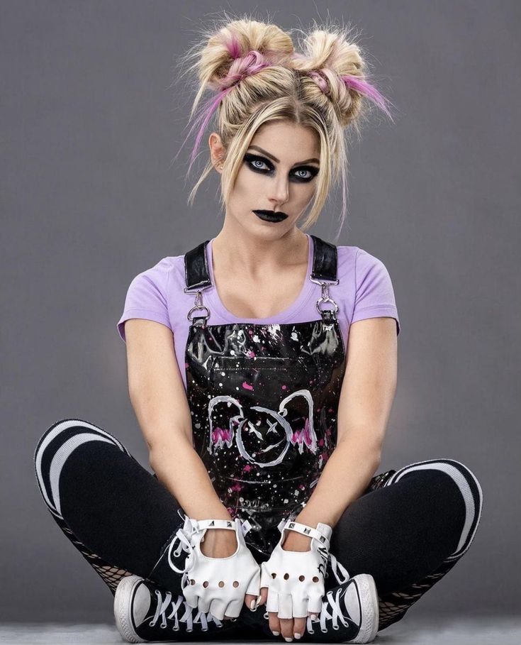 a woman with makeup on her face is sitting in the middle of a pose wearing rollerblades