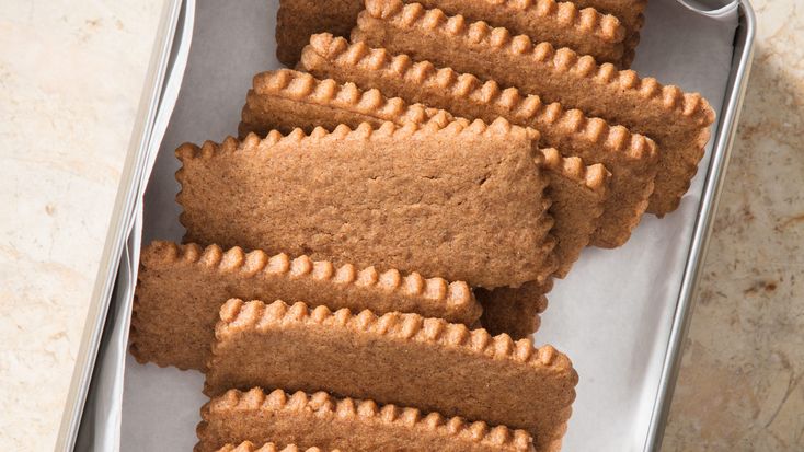 some cookies are in a tin on a table