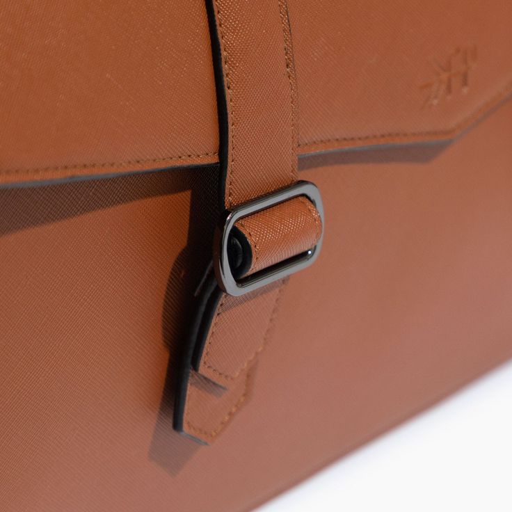 Details Designed with professionals in mind, the Cambridge Messenger Bag was made for everyone! Whether you want to upgrade your day-to-day bag for the office or want to dress to impress on your next business trip, we've got you covered. Features Made with premium quality materials and luxe hardware Magnetic front straps for easy close without zipping Premium quality zipper for main compartment opening Wearable 3 ways: backpack, cross-body, or shoulder bag Padded top handle for briefcase carry M Brown Top Handle Laptop Bag For Formal Use, Formal Brown Crossbody Laptop Bag, Formal Brown Laptop Bag With Adjustable Strap, Chic Brown Briefcase For Work, Brown Bags With Adjustable Strap For Work, Timeless Business Briefcase With Detachable Strap, Timeless Briefcase With Detachable Strap For Business, Brown Top Handle Laptop Bag For Work, Elegant Brown Briefcase With Luggage Sleeve