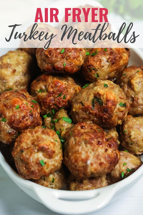 air fryer turkey meatballs in a white bowl with parsley on the side