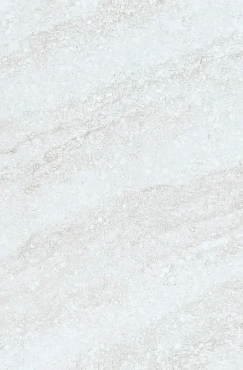 a white marble textured surface with light gray and dark grey streaks on the edges