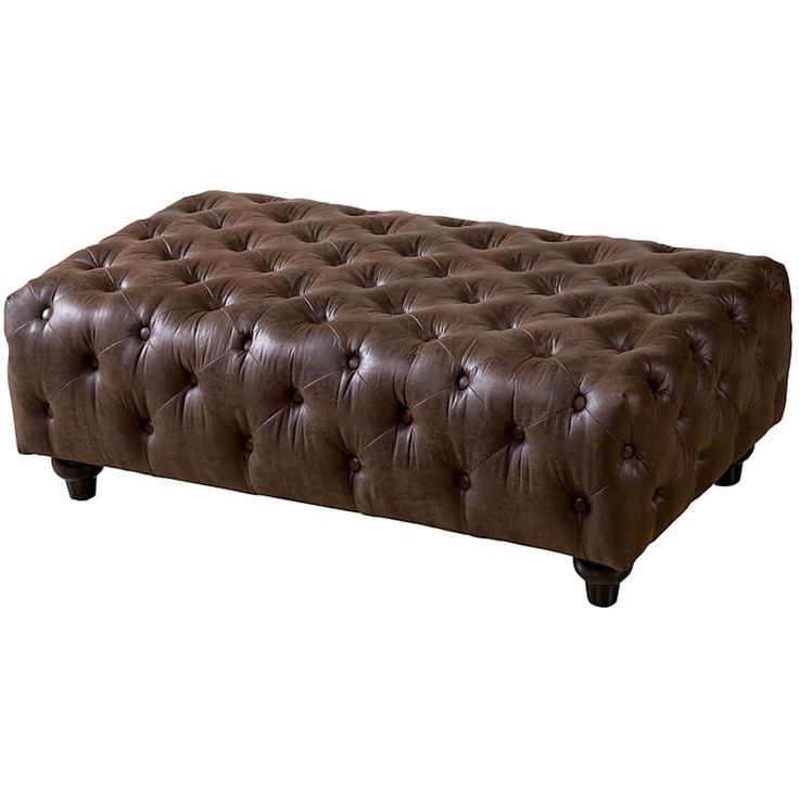 a brown leather bench with wooden legs and buttons on the bottom, in front of a white background