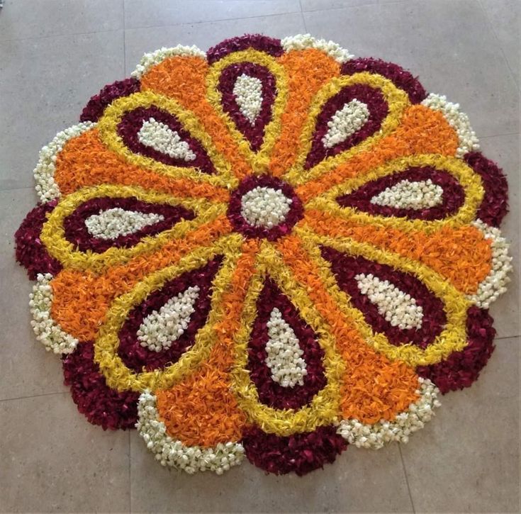 a large flower arrangement is on the floor