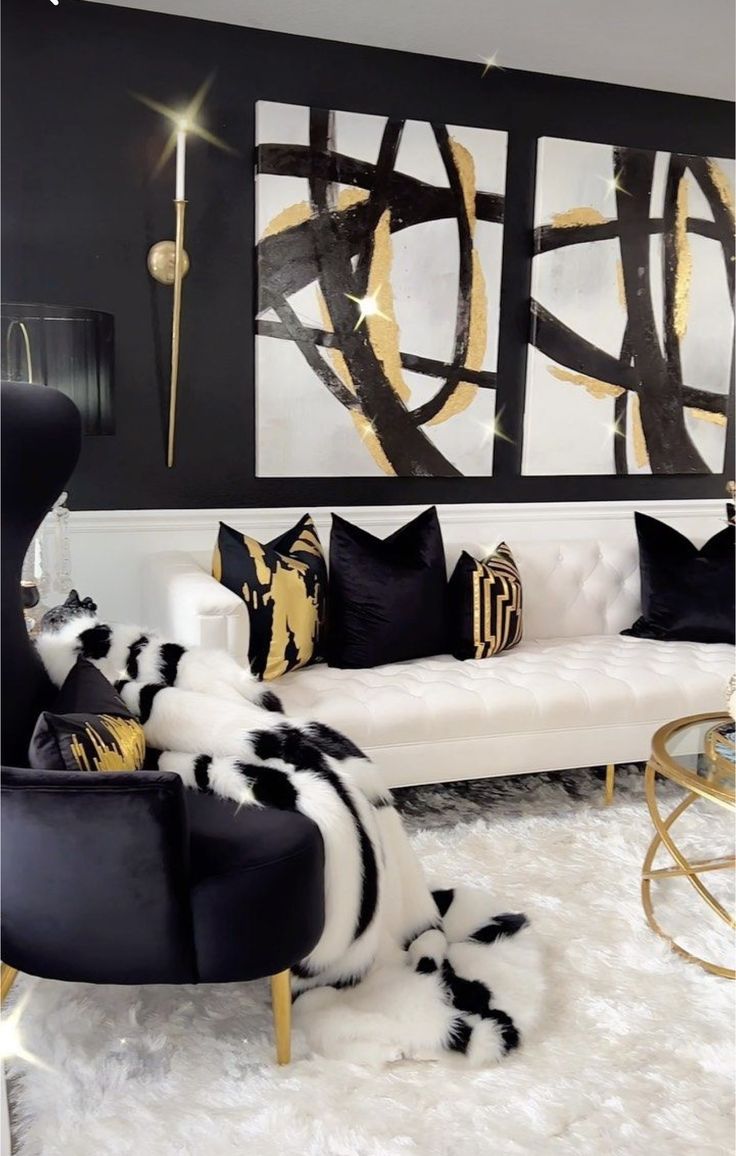 a black and white living room with gold accents