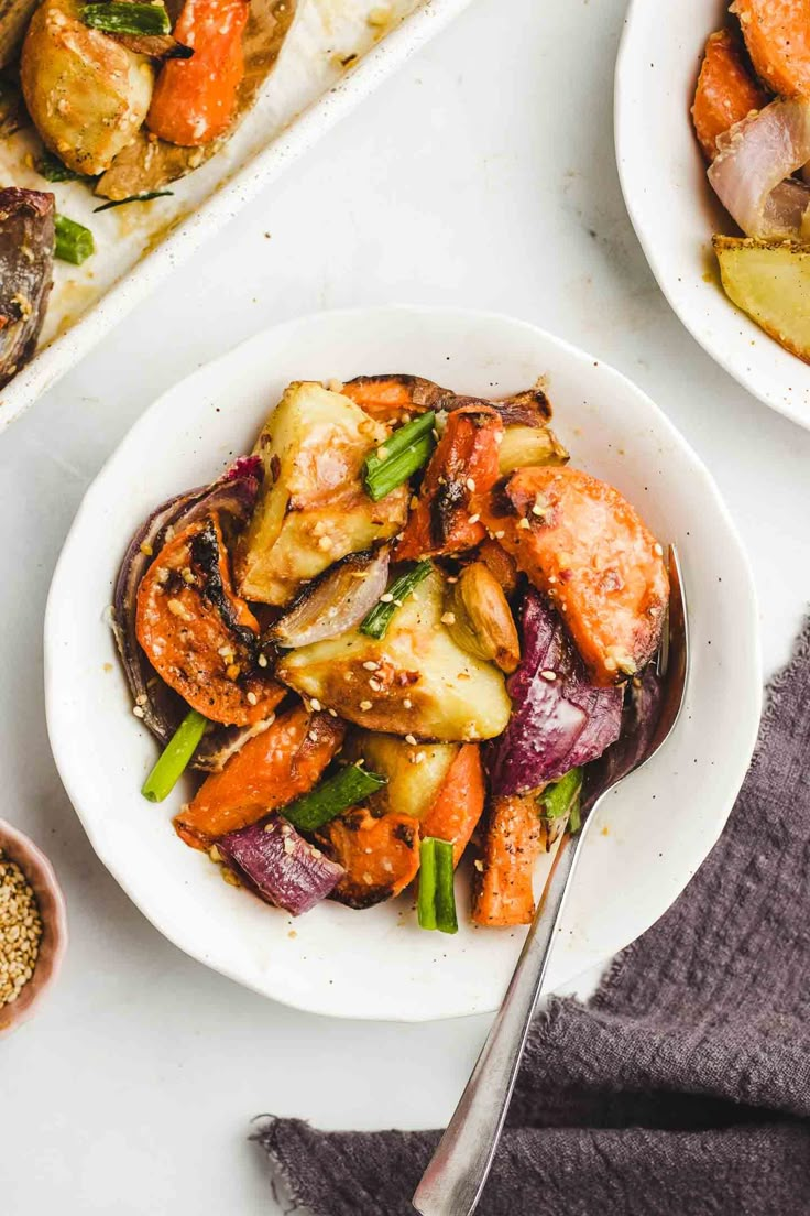 two white bowls filled with food next to each other