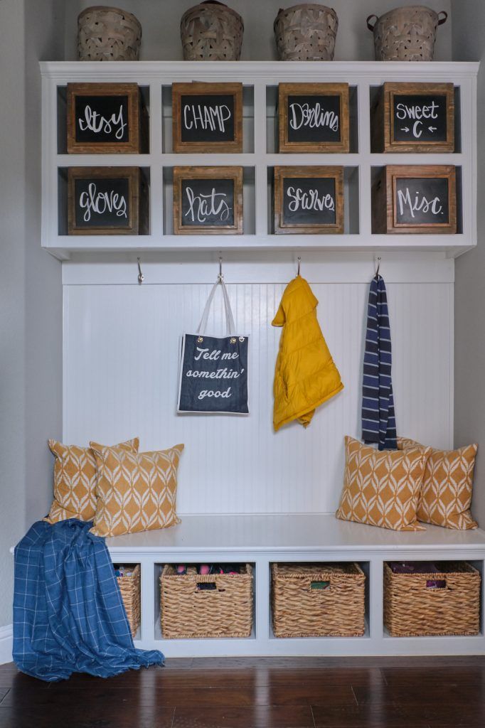 the entryway is decorated with baskets and signs