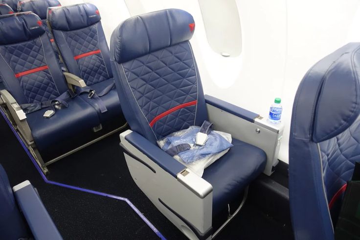 the seats in an airplane are empty and ready for people to use them on their own