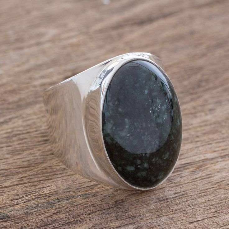 Centered by a bold oval stone of dark green Guatemalan jade this men's ring adds flair to any outfit. The band is crafted of sterling silver with an outstanding high-polish finish sure to draw attention wherever it goes. Silver Jewelry Diy, Jade Ring, Jade Jewelry, Oval Stone, Green Jade, Men's Rings, Jewelry Packaging, Jade Green, Cocktail Ring