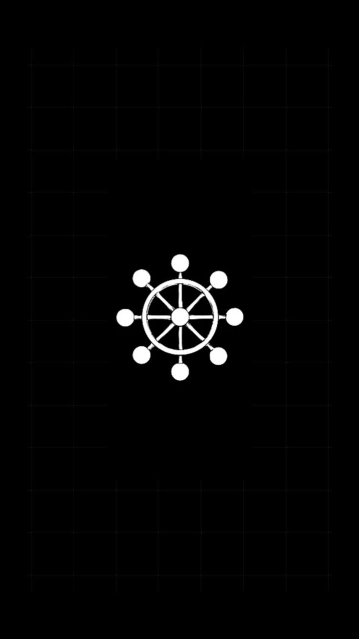 a black and white photo with an image of a compass in the center, on a dark background