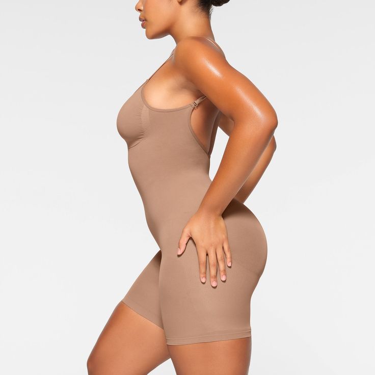 A sculpting bodysuit that sculpts silhouette, cinches waist, and smooth thighs while providing support and lift for your curves. Featuring a deep scoop back that makes it the perfect backless shapewear option. | SKIMS Low Back Mid Thigh Bodysuit | Medium Neutral | Seamless Sculpt Backless Shapewear, Sculpting Bodysuit, Fall Shopping, Cinched Waist, Low Back, Shapewear, Lounge Wear