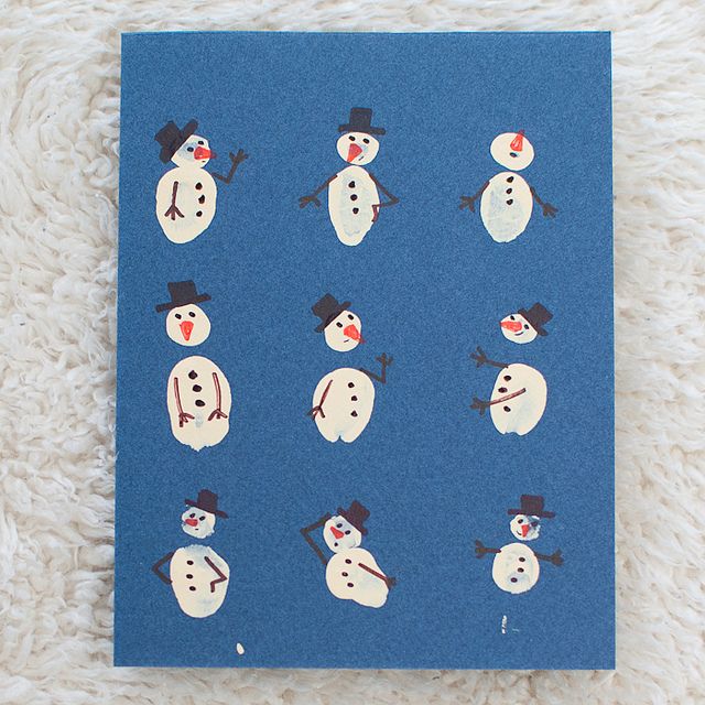 there are many snowmen on this blue card