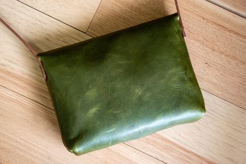 Green Leather Crossbody Saddle Bag, Green Leather Saddle Bag For Daily Use, Green Rectangular Leather Saddle Bag, Green Leather Rectangular Saddle Bag, Green Leather Saddle Bag With Removable Pouch, Green Rectangular Leather-lined Bag, Green Leather Satchel With Leather Lining, Green Crossbody Saddle Bag With Removable Pouch, Green Top Handle Satchel With Leather Lining