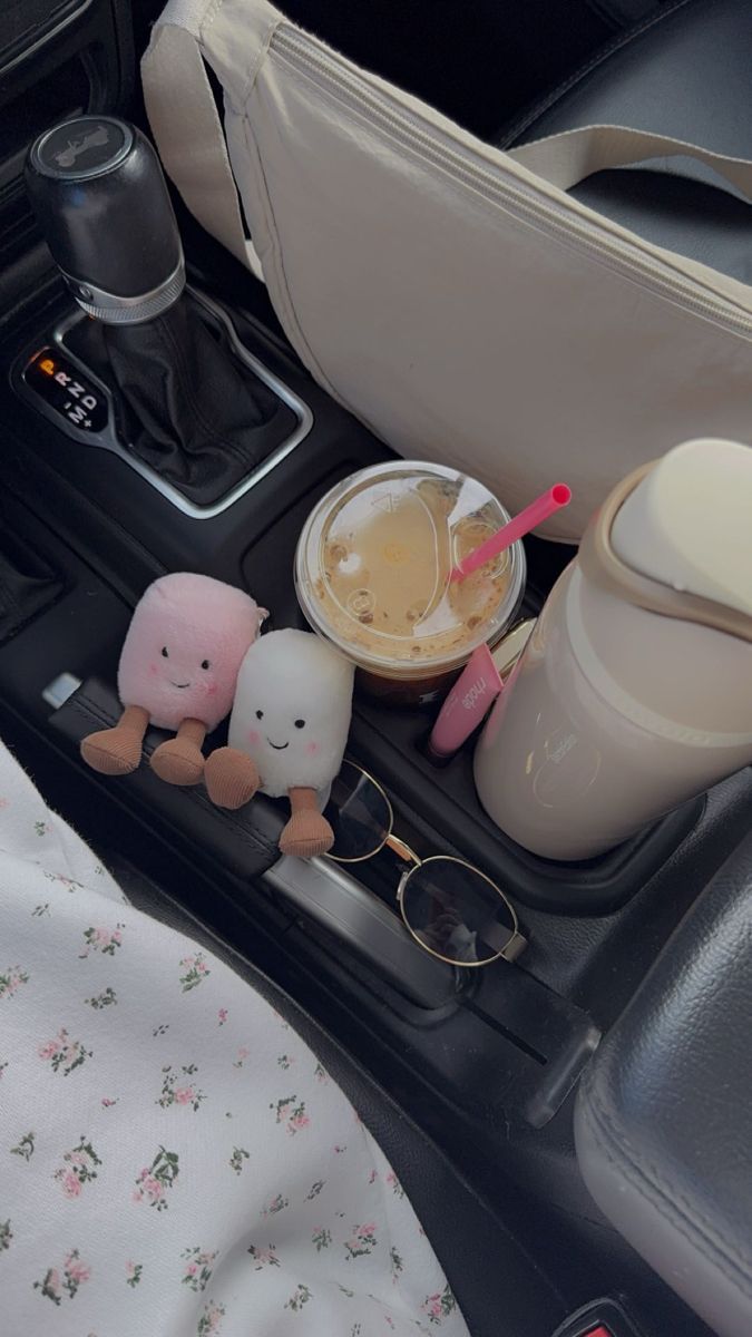 the interior of a car with various items in it