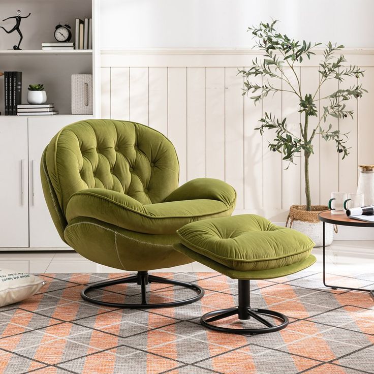 a green chair and ottoman in a living room