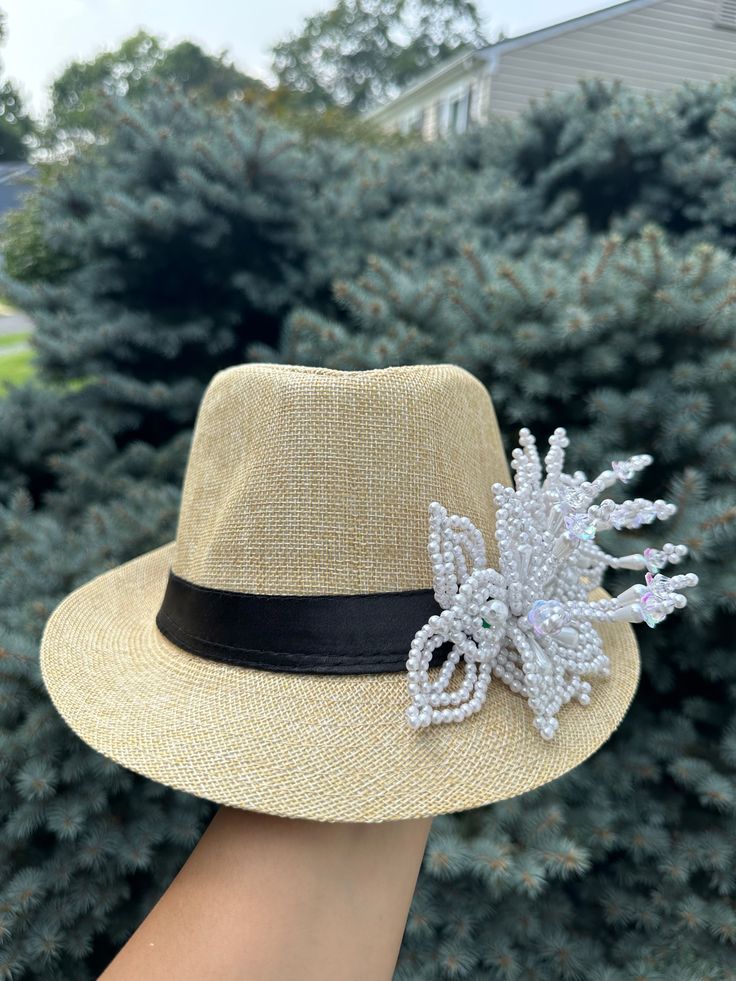 Panama hat / fedora straw hat decorated with a handmade beaded pearl tembleque flowers. This hat is perfect to cover yourself from the sun and show your Panamanian pride at the same time —- Very chic and cute style... will match all your outfits Summer Panama Hat For Spring Parties, Elegant Handmade Fedora For Beach, Elegant Summer Fedora For Festivals, Brimmed Panama Hat For Summer Party, Handmade Summer Panama Hat For Kentucky Derby, Elegant Handmade Panama Hat For The Beach, Elegant Handmade Panama Hat For Beach, Adjustable Panama Hat For Summer Party, Summer Party Fedora Straw Hat