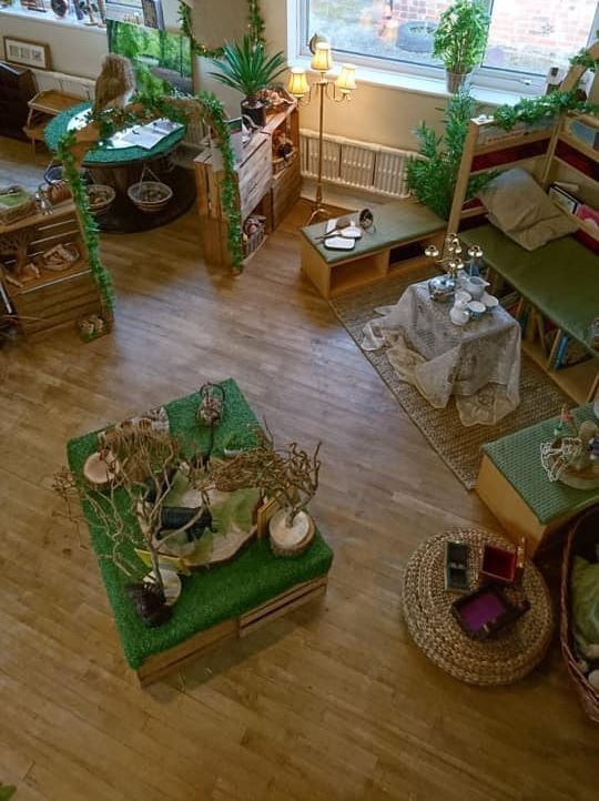 a living room filled with furniture and lots of plants