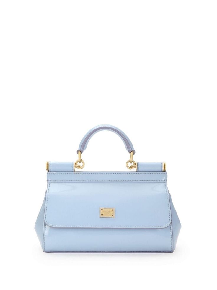 This chic little number in light blue is perfect for those who love a pop of color in their accessory collection. Made from shiny calfskin leather, it’s both stylish and versatile, fitting right in whether you're headed to brunch or a night out. Plus, it’s got just the right amount of space for all your essentials without weighing you down. Adjustable and detachable shoulder strap Front flap with concealed double magnetic button closure Logo plaque on the front for a touch of elegance Internal f Leopard Print Fabric, Top Handle Handbags, Leather Cap, Engraved Logo, Chic Accessories, Logo Stamp, Leather Mini, Blue Bags, Small Bag