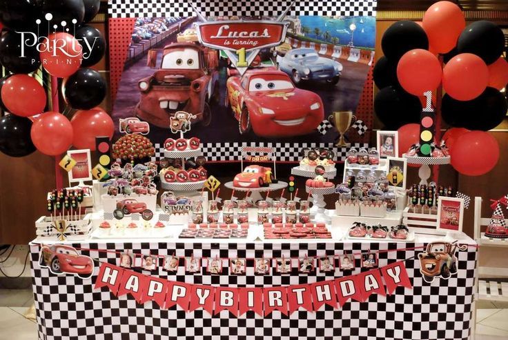 cars birthday party table with balloons and decorations