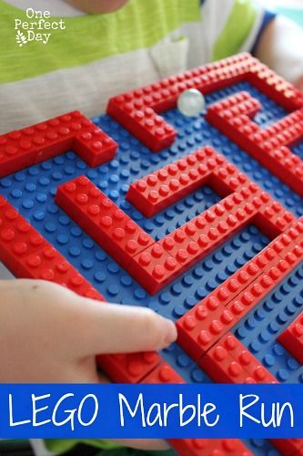 a lego marble run game for kids to play on the table with text overlay that reads, lego marble run