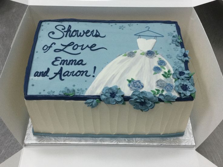 there is a cake in the shape of a wedding dress on it's box