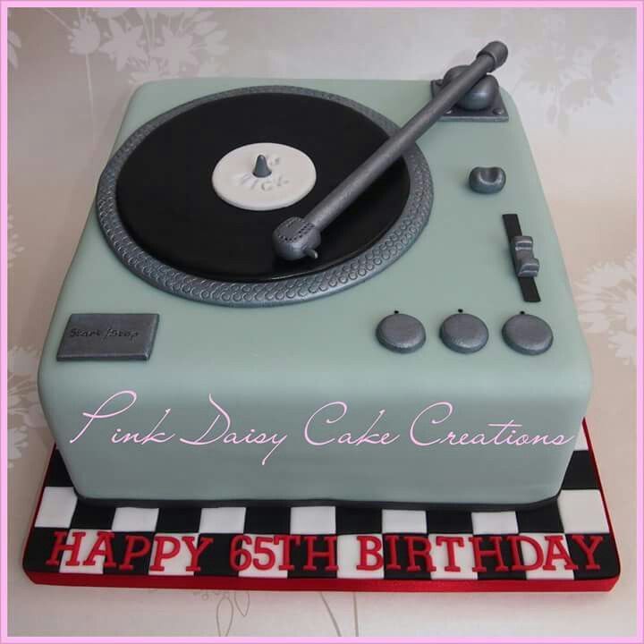 a birthday cake with a record player on it