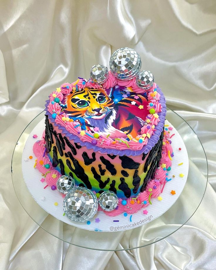 a colorful cake on top of a glass plate