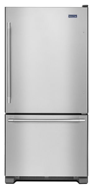 a stainless steel refrigerator freezer sitting on top of a white surface with the door open