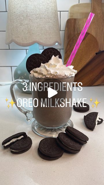 an oreo milkshake with chocolate cookies and whipped cream