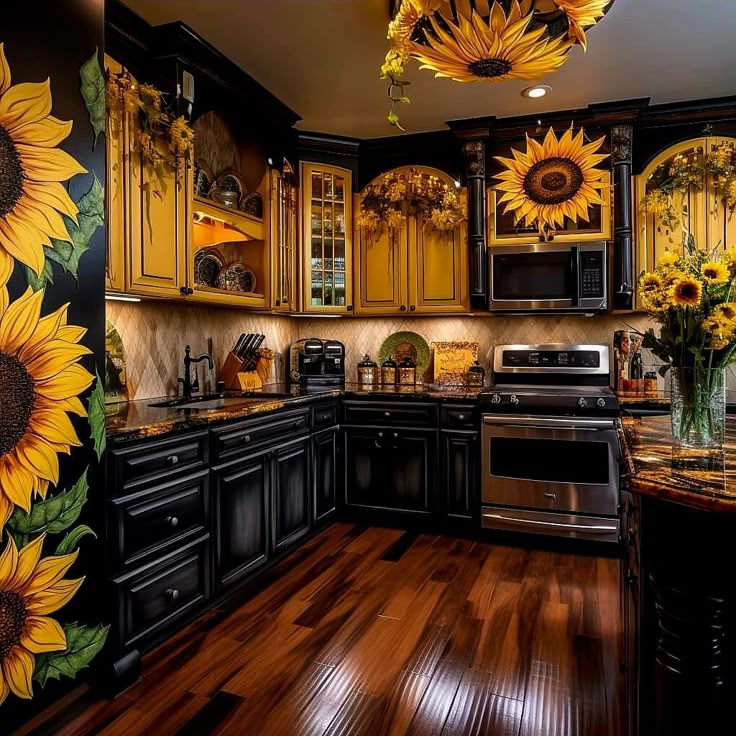 a kitchen with sunflowers painted on the wall and wood flooring in it