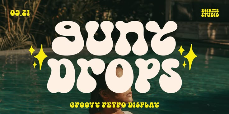 the sun drops font is displayed in front of a pool