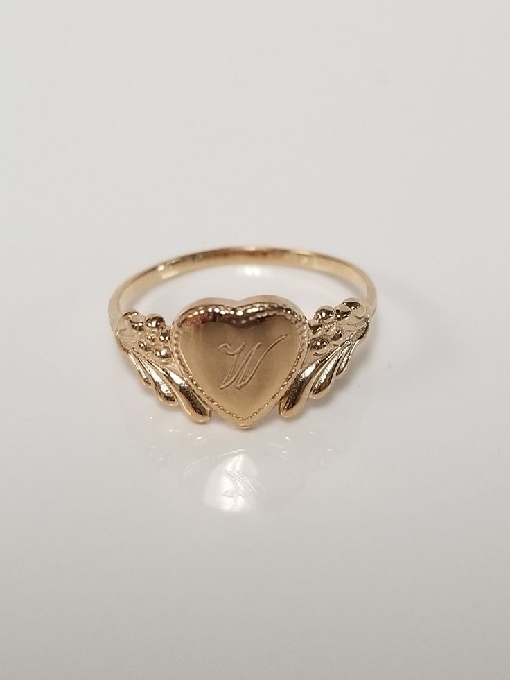 "Thanks for shopping our vintage estate store. We tend to sell well below wholesale and truly hope you enjoy all of our items. Many of the items are one of a kind, so please enjoy scrolling through the pictures and hopefully something will catch your eye. Brown spots are from camera or reflections. Estate 14k yellow gold monogram cursive capital W heart ring. Custom made ring for our shop. Ring size: 3 Setting: 7.5mm 1/4\" to 3/8\" Band width: 1.4mm Weight: 1.06 gram Marked 14k and it's sweet. O Vintage Gold Initial Ring Stamped 14k, Victorian 14k Gold Jewelry With Hallmark, Victorian Jewelry In 14k Gold With Hallmark, Classic Oval Heart Ring For Valentine's Day, Victorian 14k Gold Jewelry For Valentine's Day, Classic Heart-shaped 14k Gold Signet Ring, Classic Heart Shaped 14k Gold Signet Ring, Vintage White Gold Signet Ring Stamped 14k, Classic 14k Gold Heart-shaped Signet Ring