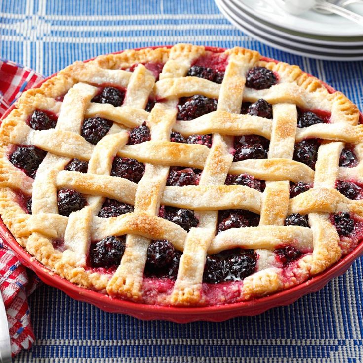 a pie sitting on top of a blue table cloth