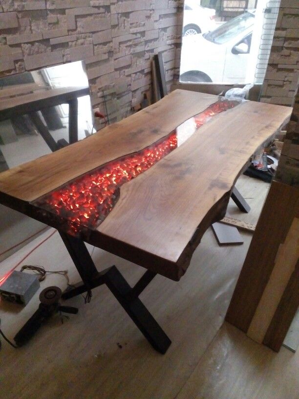 a wooden table with red lights on it